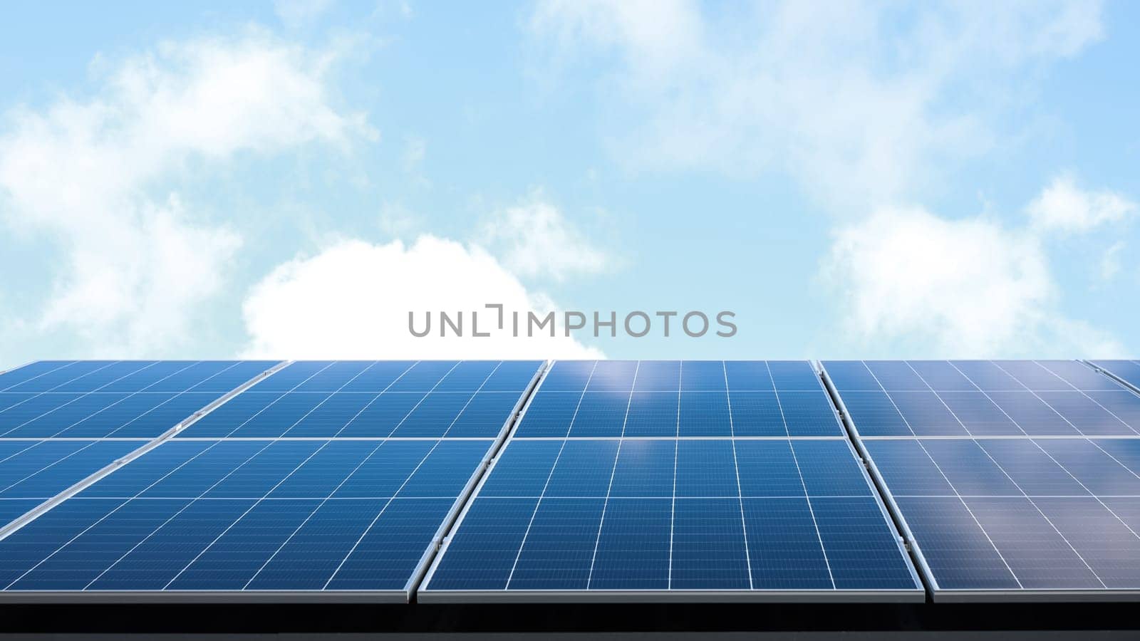 Aerial view of solar panel cells against cloudy blue sky. Alternative energy concept, sustainable resources. House with solar panels stand-alone photovoltaic plant system. Professional installation