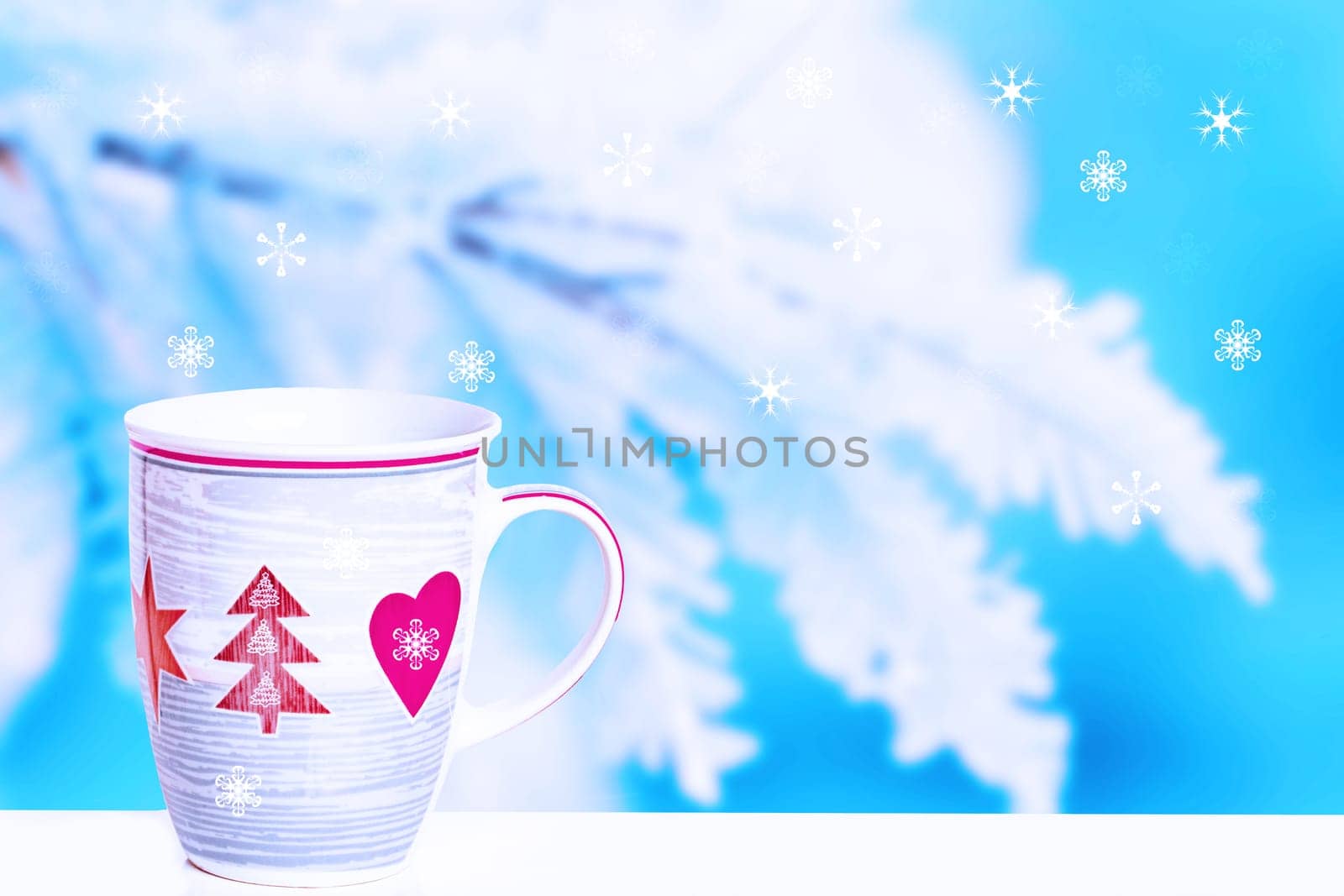 Christmas greeting card. Large white winter mug with coffee, decorated with red Christmas trees, hearts and stars over snow-covered branches and snowflakes.