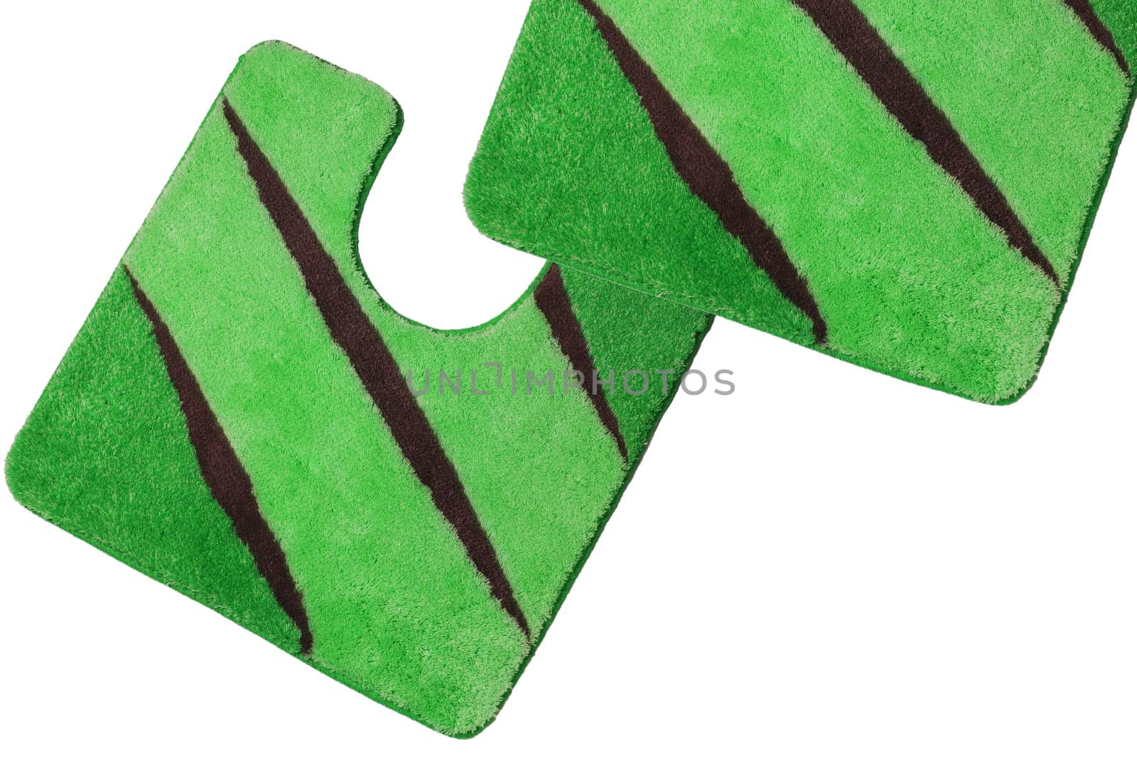 Close up of non slip green brown fluffy soft bath mats or rugs isolated on white background. Bath Accessories. Top view.