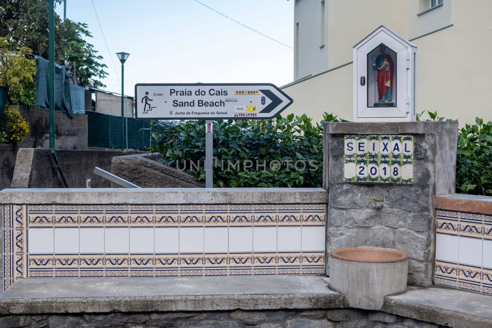 Seixal, Madeira, Portugal, November 3rd 2024: Direction sign to Praia do Cais Sand Beach in Seixal on Madeira Island, Portugal
