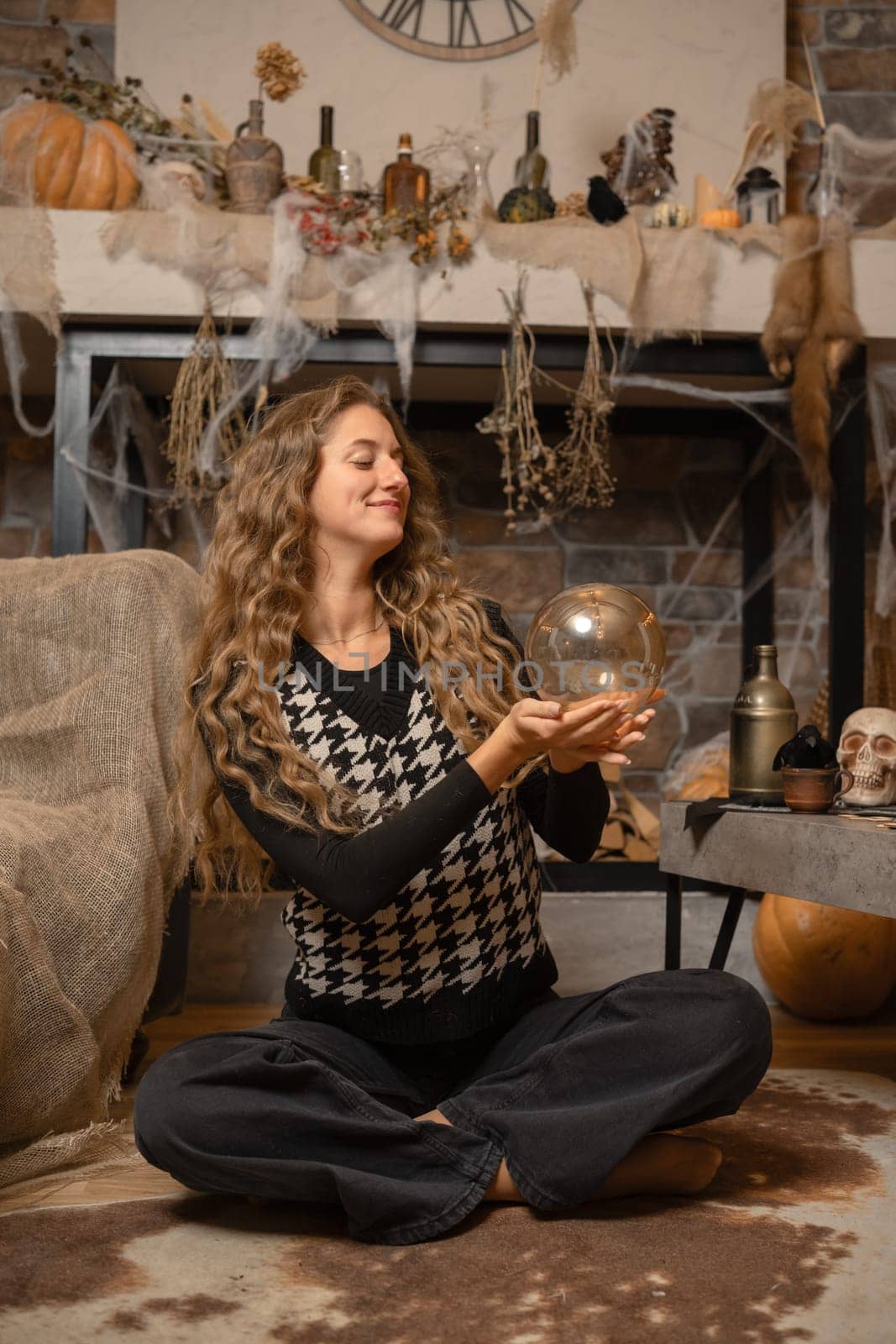 The setting features a woman sitting cross-legged, holding a crystal ball and smiling with curiosity.