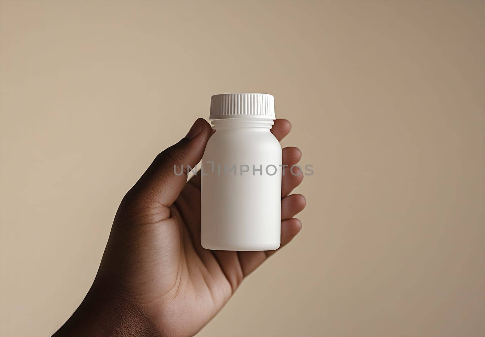 A hand gently holds a small white bottle against a solid beige background, highlighting its clean design and simplicity.