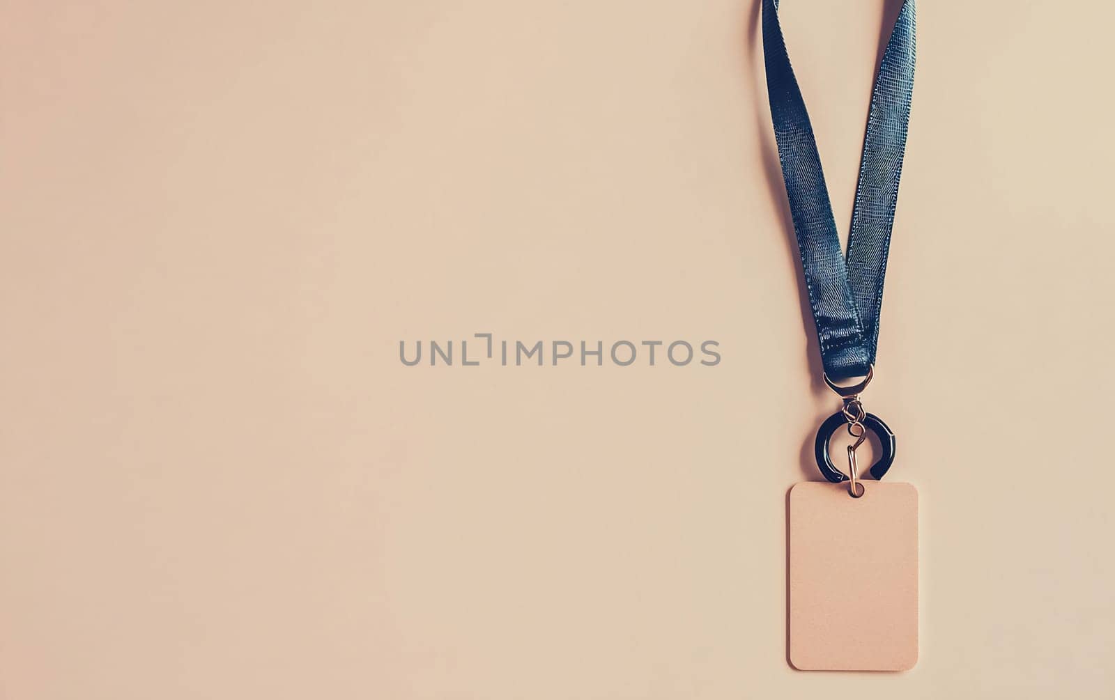 A medal hangs from a blue ribbon, featuring a blank tag attached, suitable for customization. It has a minimalist design and soft colors.