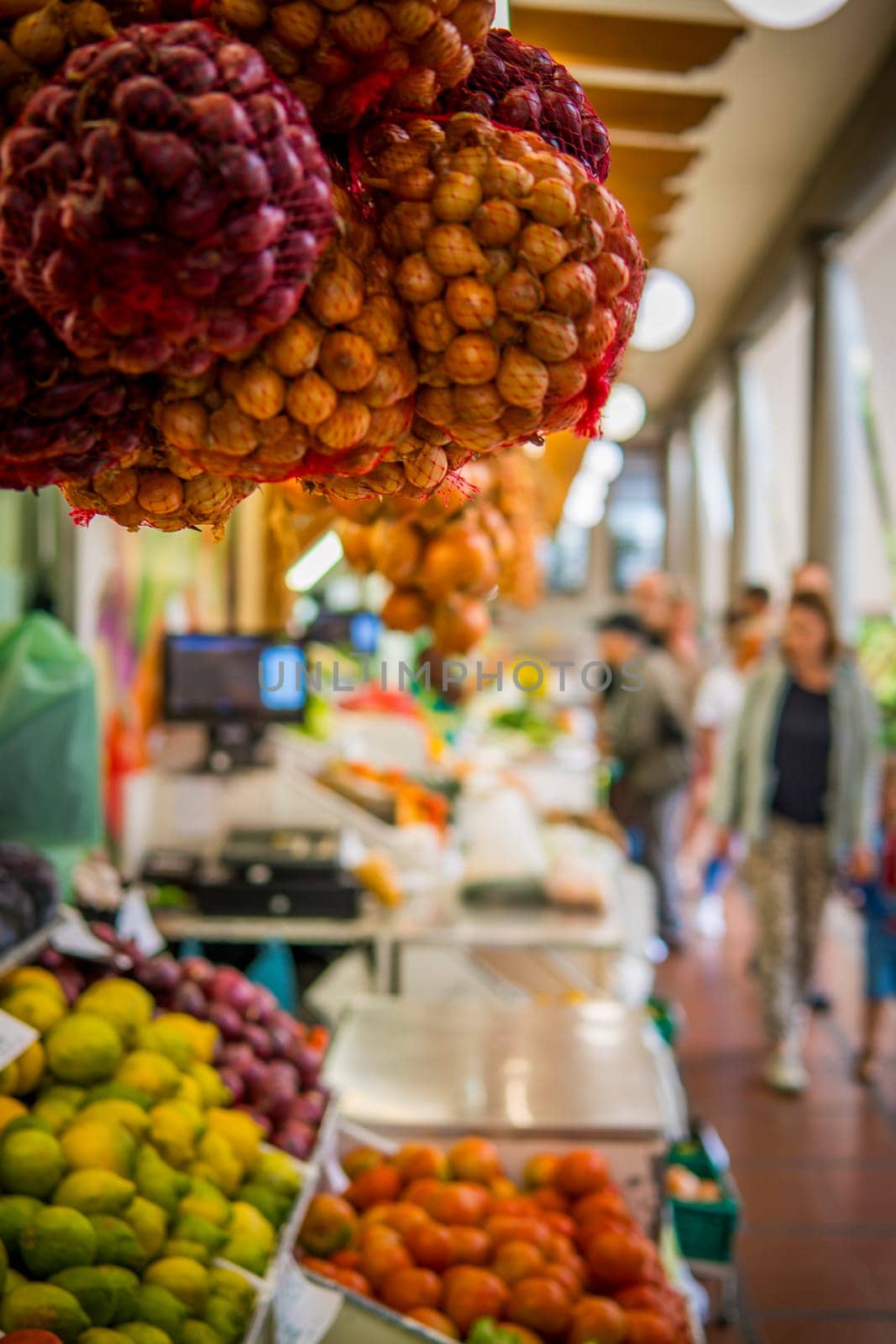 Funchal, Madeira, Portugal, November 7th 2024: People shopping for fruit and vegetables on on the Mercado dos Lavradores, Farmers market, in Funchal, Madeira