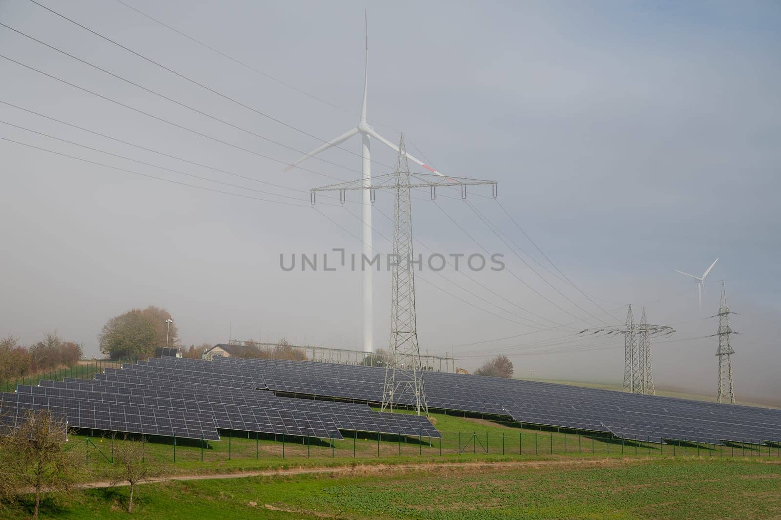 Windmill with solar panel, transformation to renewable sustainable energy, electricity generator, environmental conversation