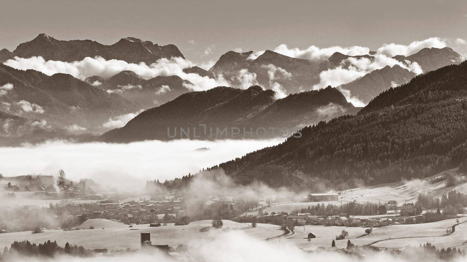 Drone photo of fog in the Allgäu Alps in black and white