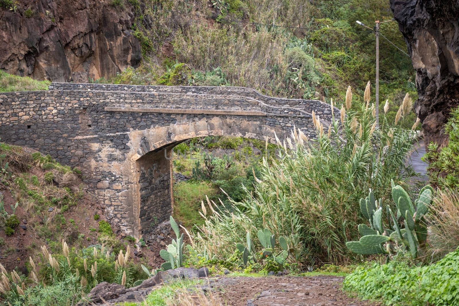 View on the old stone bridge near Ponta do Sol and ER101 road on Madeira, Portugal