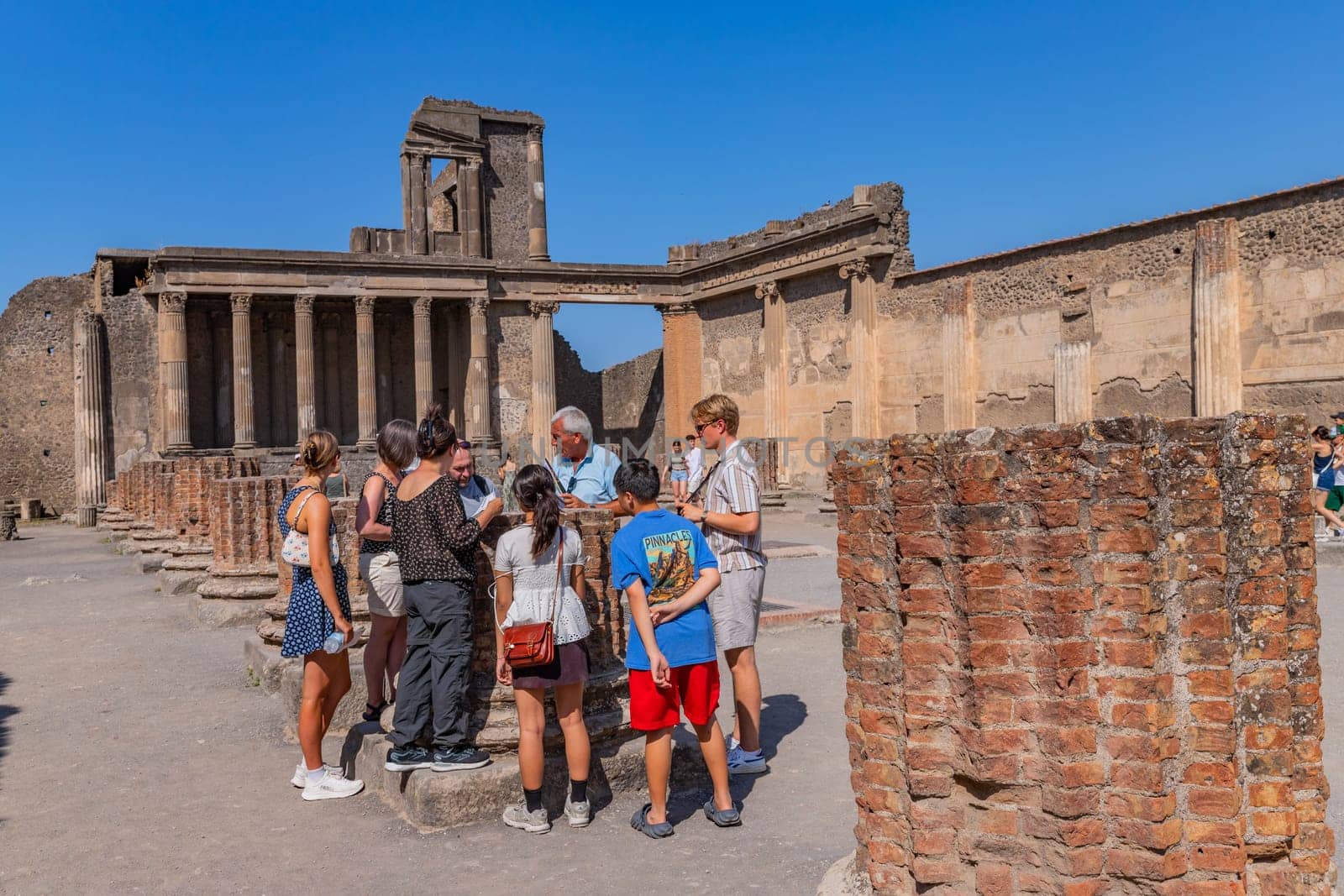 Pompeii, Italy - August 8, 2024: Ruins of a city. Pompeii is an ancient Roman city died from the eruption of Mount Vesuvius in 79 AD.