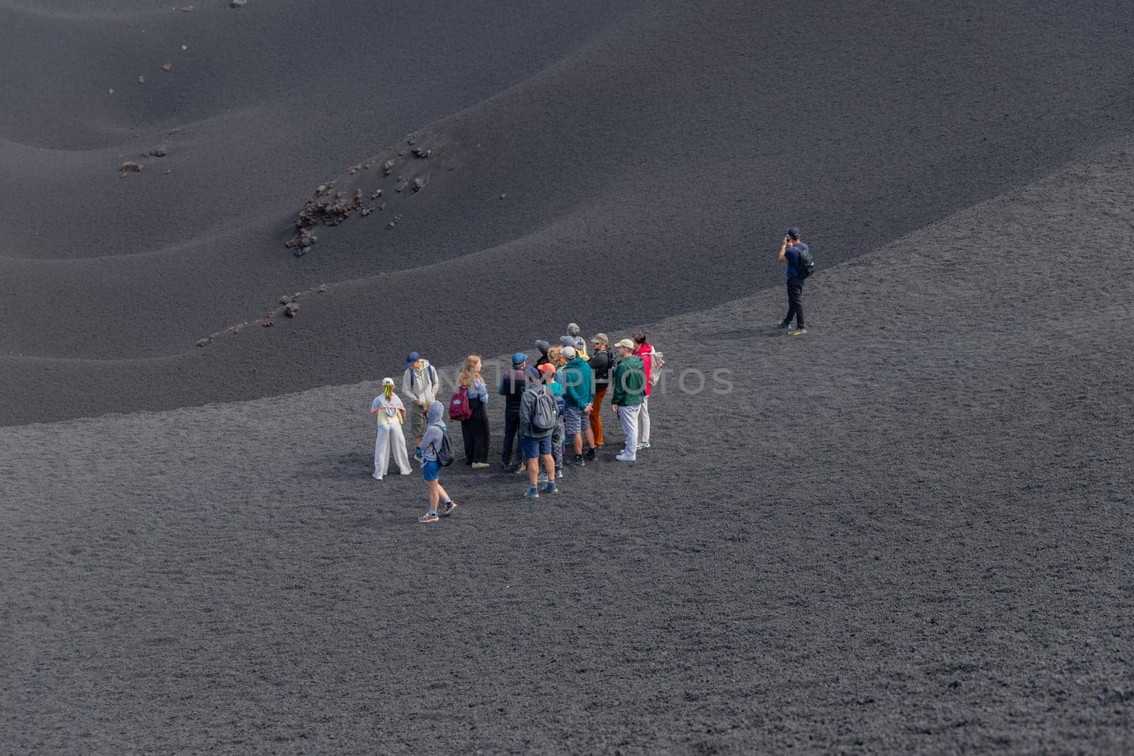 Mount Etna, Catania, Sicily, Italy - August 13, 2024: People walking on crater of active volcano in Mount Etna, Sicily, Italy