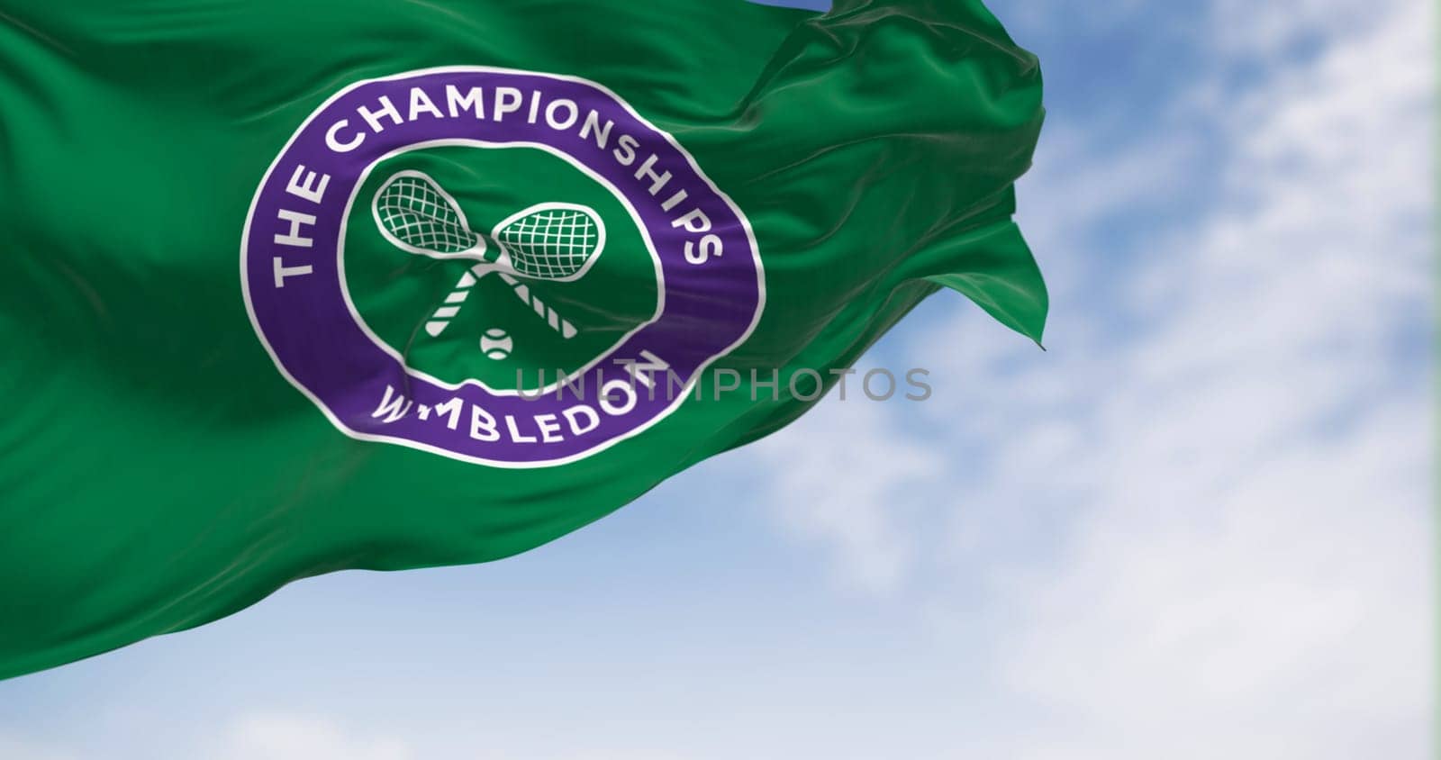 London, UK, May 2023: Flag with The Championships Wimbledon logo waving in the wind. Wimbledon Championships is a major tennis tournament. Illustrative editorial 3d illustration render.