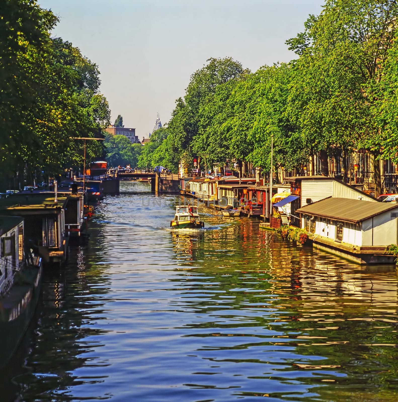 Boat on canal in Amsterdam, Netherlands