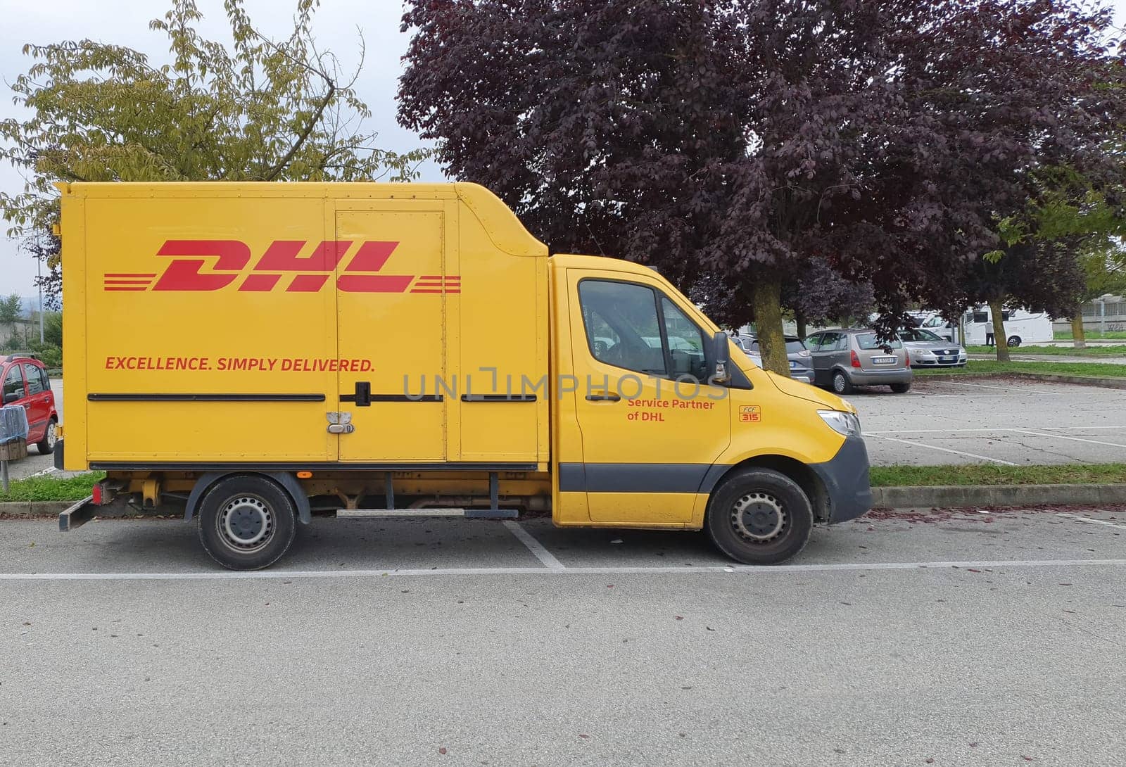 TURIN, ITALY - OCTOBER 12, 2024: DHL courier van