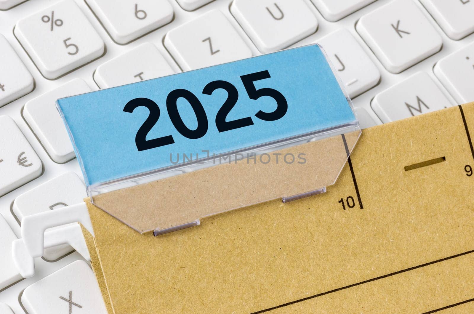A brown file folder labeled with 2025