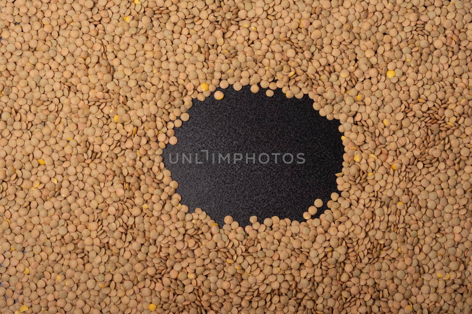 Lentils texture pattern with empty space background, top viewpoint