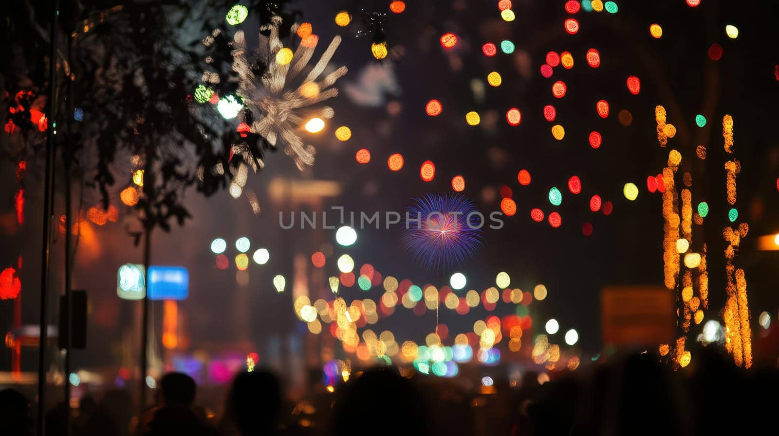 Crowds enjoy a vibrant night celebration filled with fireworks and colorful lights in an urban setting during a festive occasion.