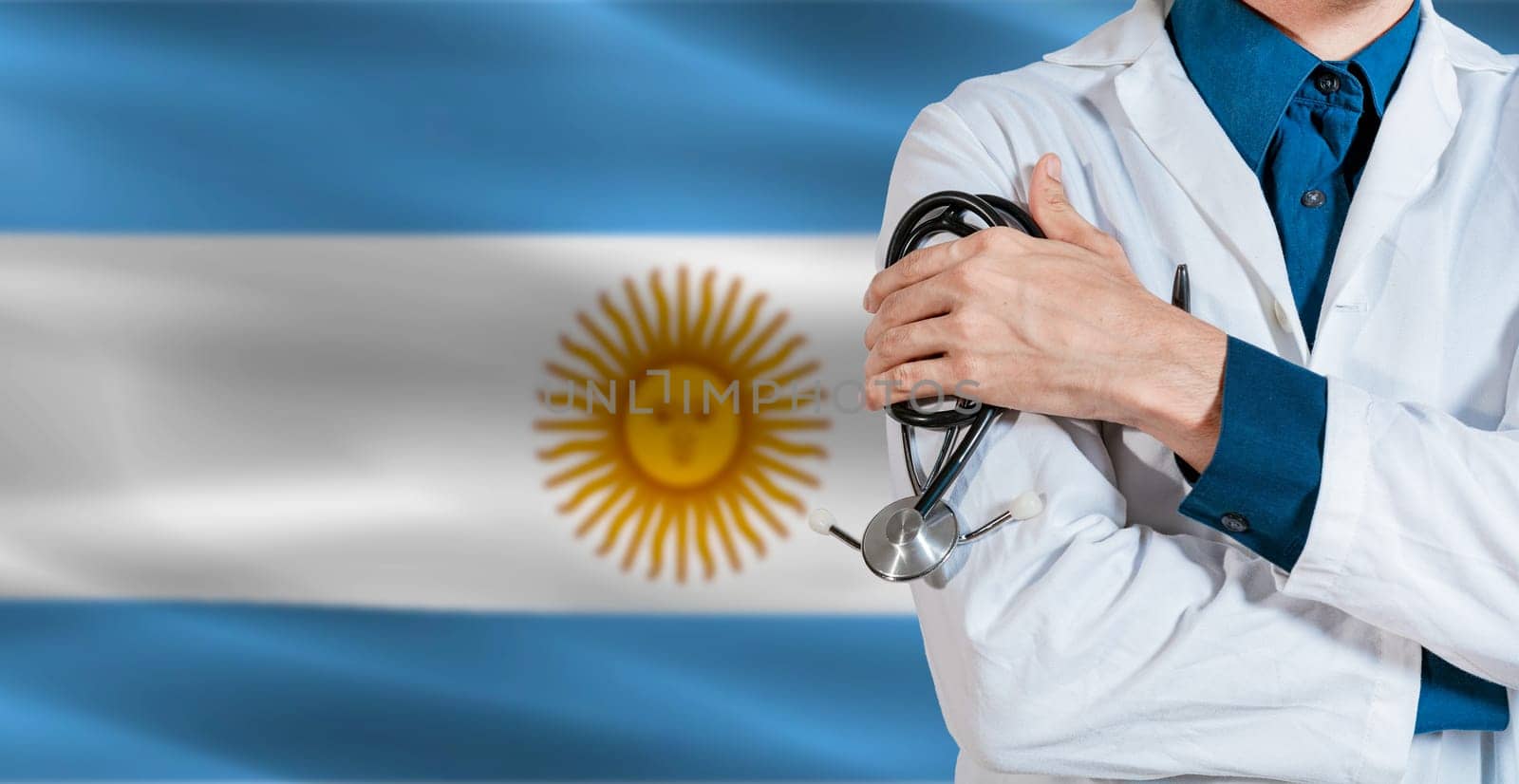 Doctor with stethoscope on Argentina flag. Male Doctor holding stethoscope on Argentine flag