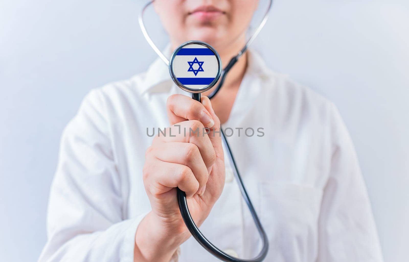 Doctor showing stethoscope with Israel flag. Israel National Healthcare concept