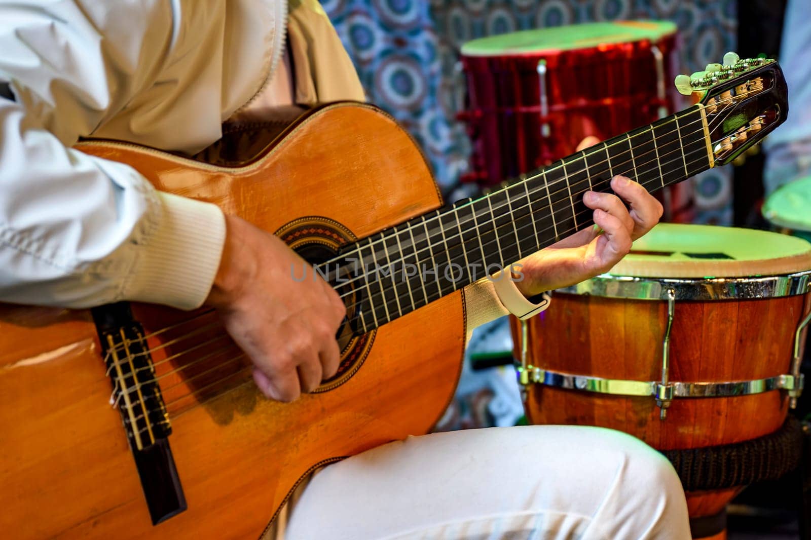 Acoustic guitar player in stage during brazilian popular music presentation