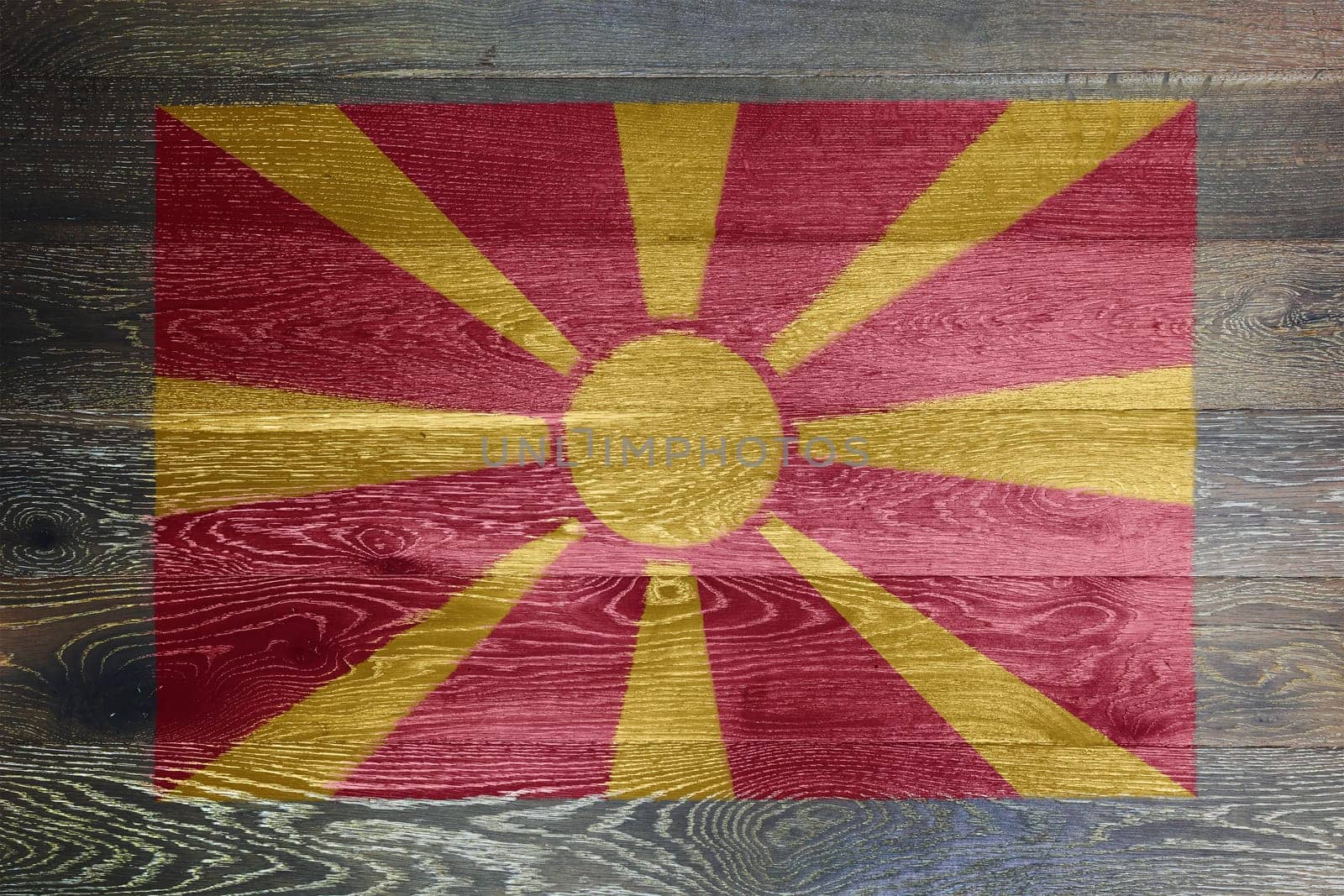 A North Macedonia flag on rustic old wood surface background