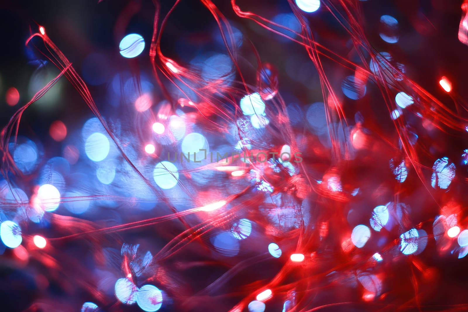 Bright red and blue lights create a mesmerizing display with colorful patterns illuminating the surroundings vibrantly during nighttime.