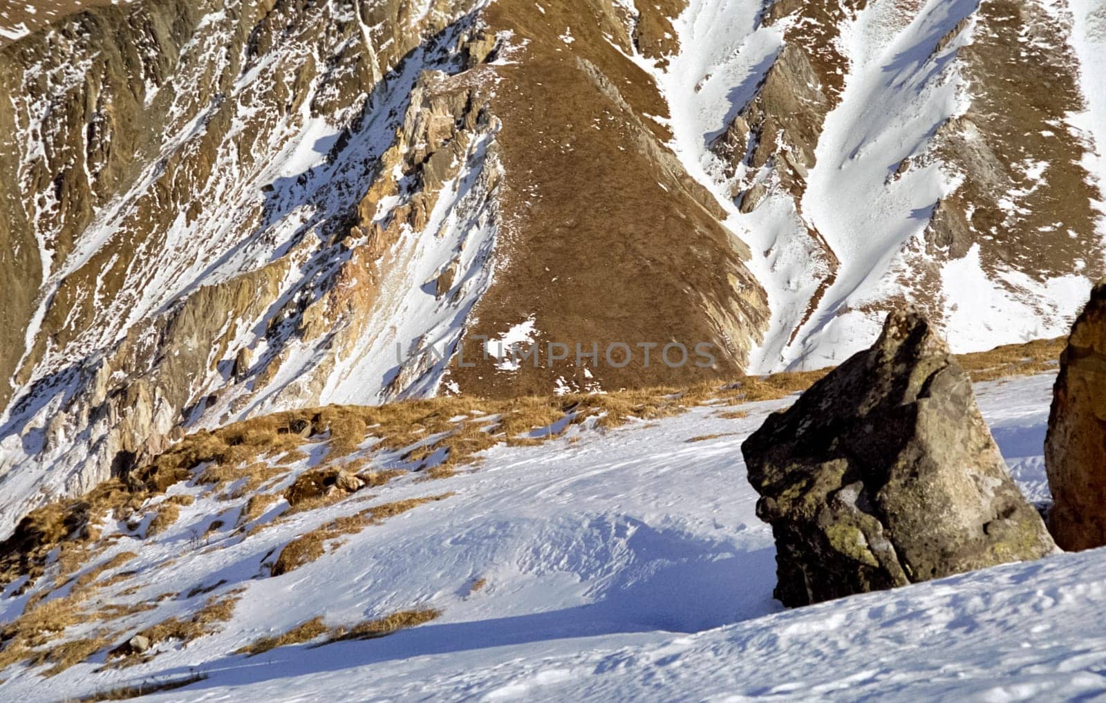 Mount Sayan in winter in the snow. The nature of the mountains is sayan.