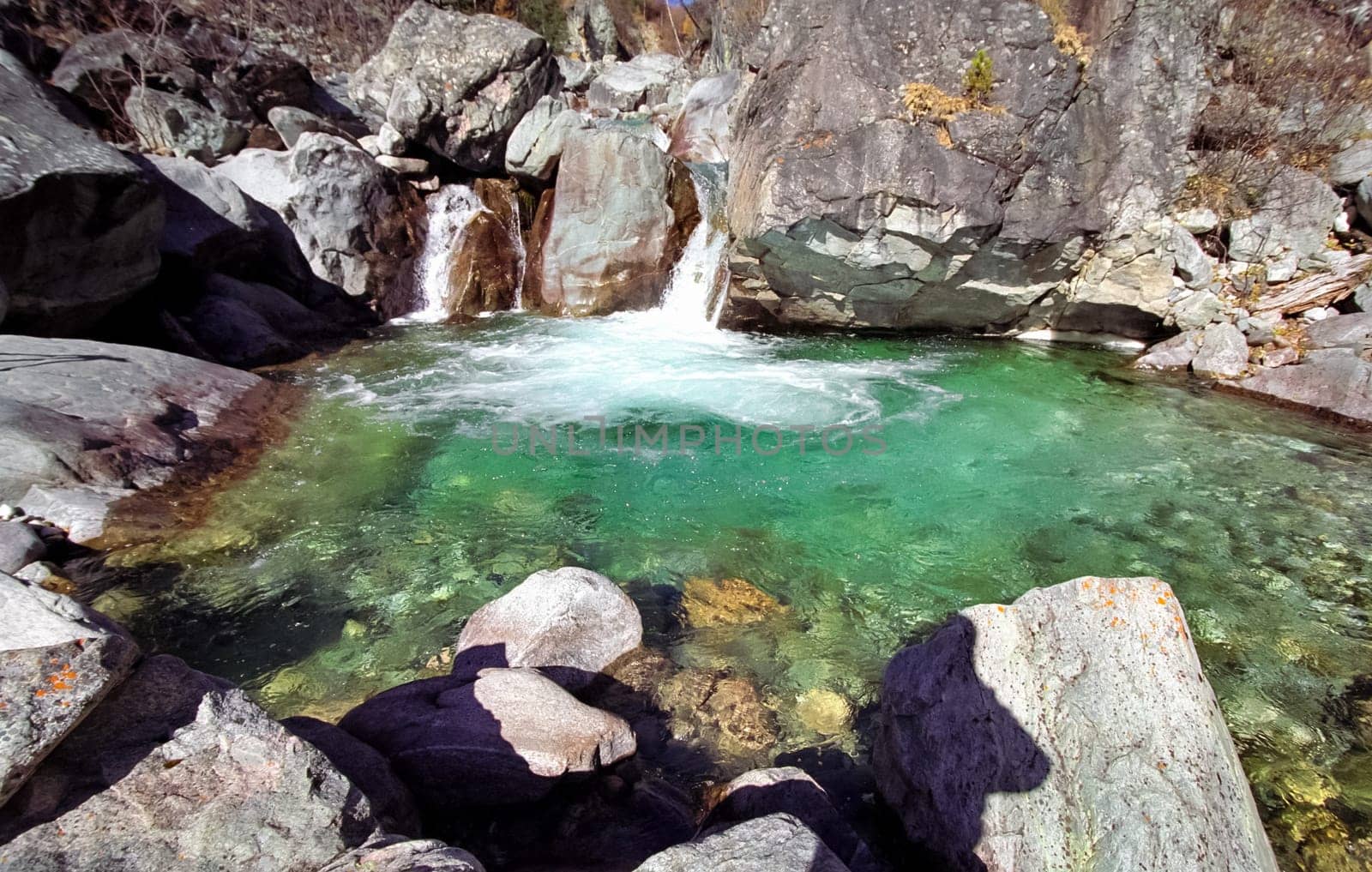 Mountain river. Stones and water of a mountain river. The mountains are said.