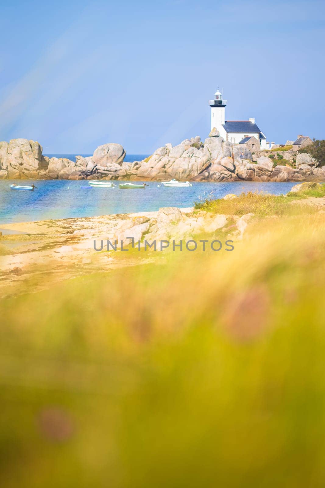 Pontusval lighthouse vertically photographed from the grass in Kerlouan, northern Brittany, France