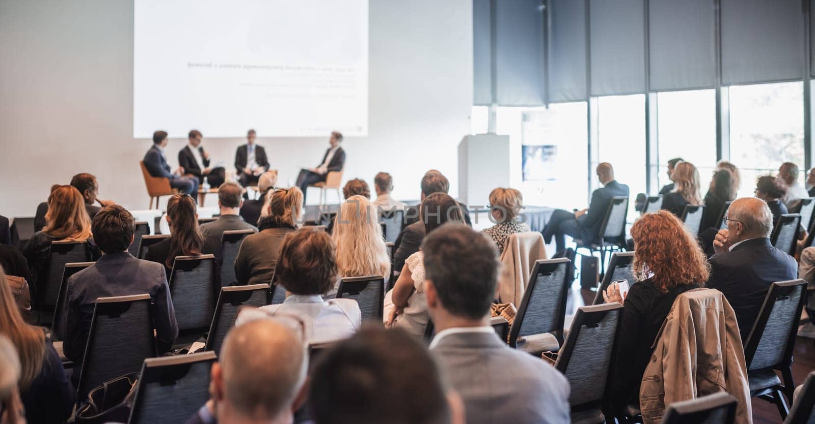 Interview and round table discussion at business convention and presentation. Audience at the conference hall. Business and entrepreneurship symposium.