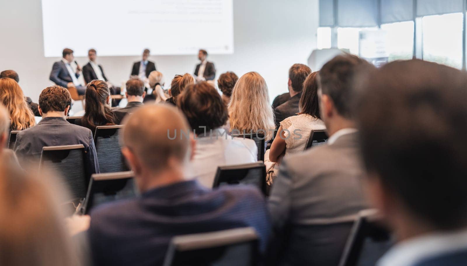 Interview and round table discussion at business convention and presentation. Audience at the conference hall. Business and entrepreneurship symposium.