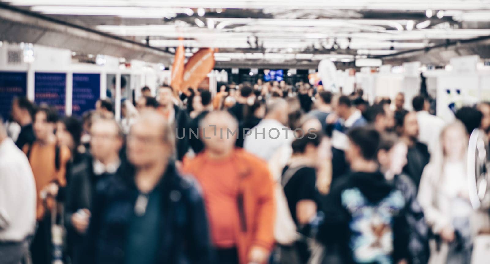 Abstract blurred people at exhibition hall of expo event trade show. Business convention show or job fair. Business concept background