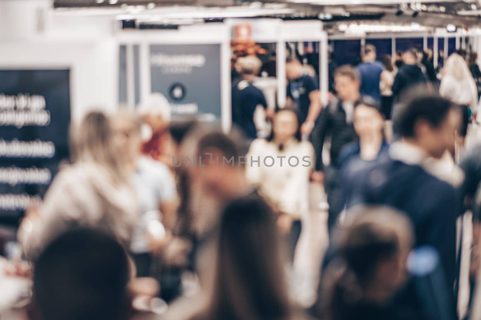 Abstract blurred people at exhibition hall of expo event trade show. Business convention show or job fair. Business concept background