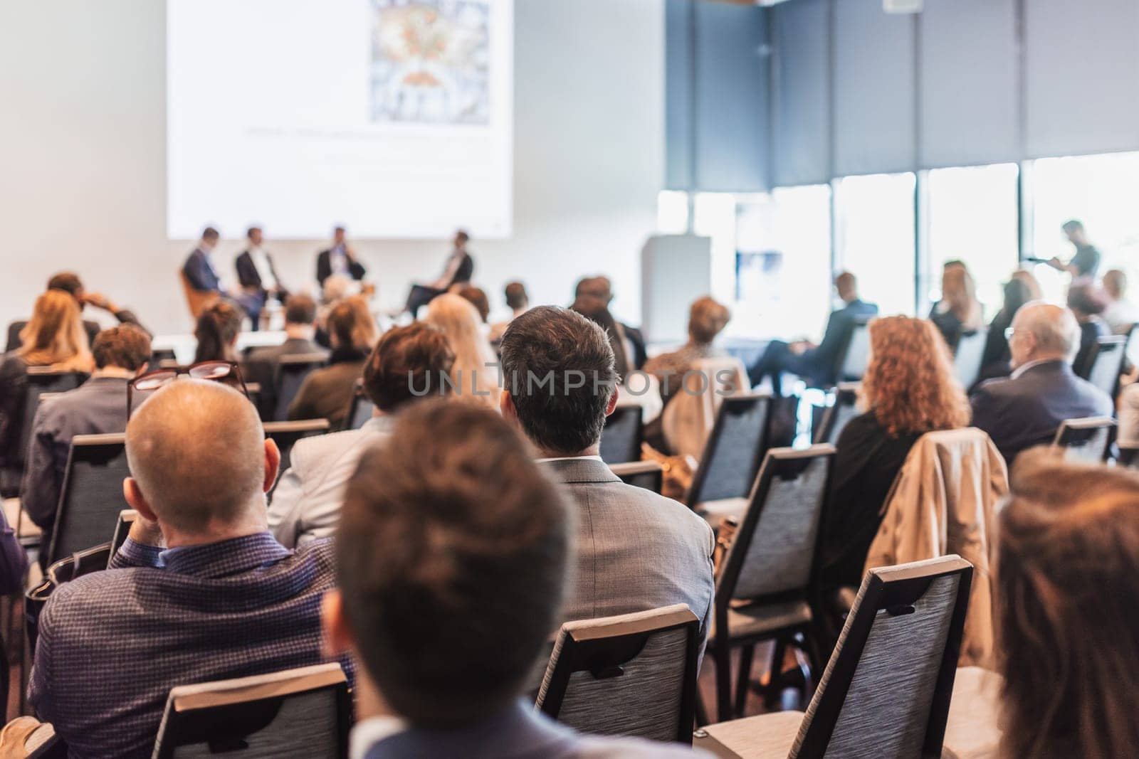 Interview and round table discussion at business convention and presentation. Audience at the conference hall. Business and entrepreneurship symposium.