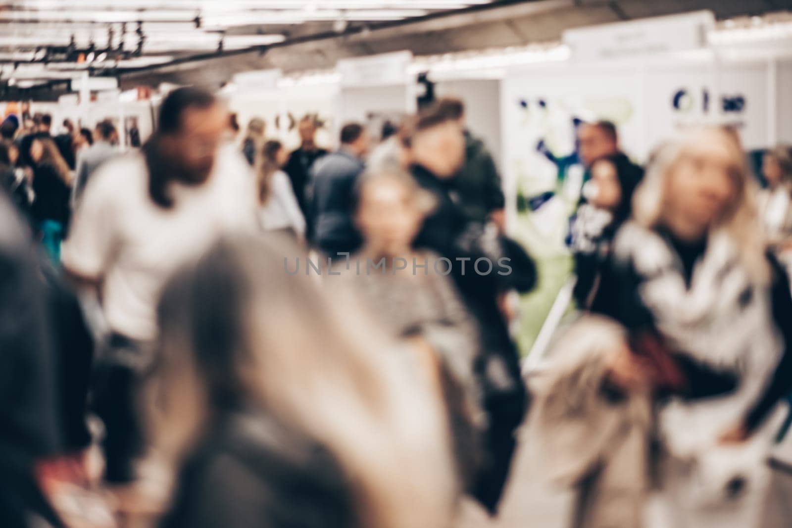Abstract blurred people at exhibition hall of expo event trade show. Business convention show or job fair. Business concept background