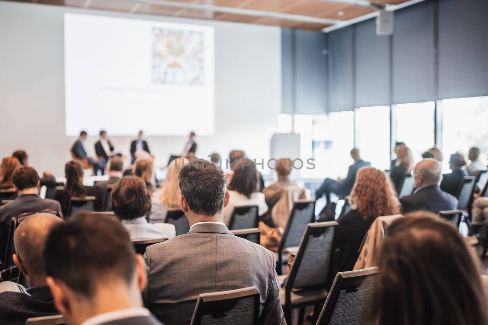 Interview and round table discussion at business convention and presentation. Audience at the conference hall. Business and entrepreneurship symposium.