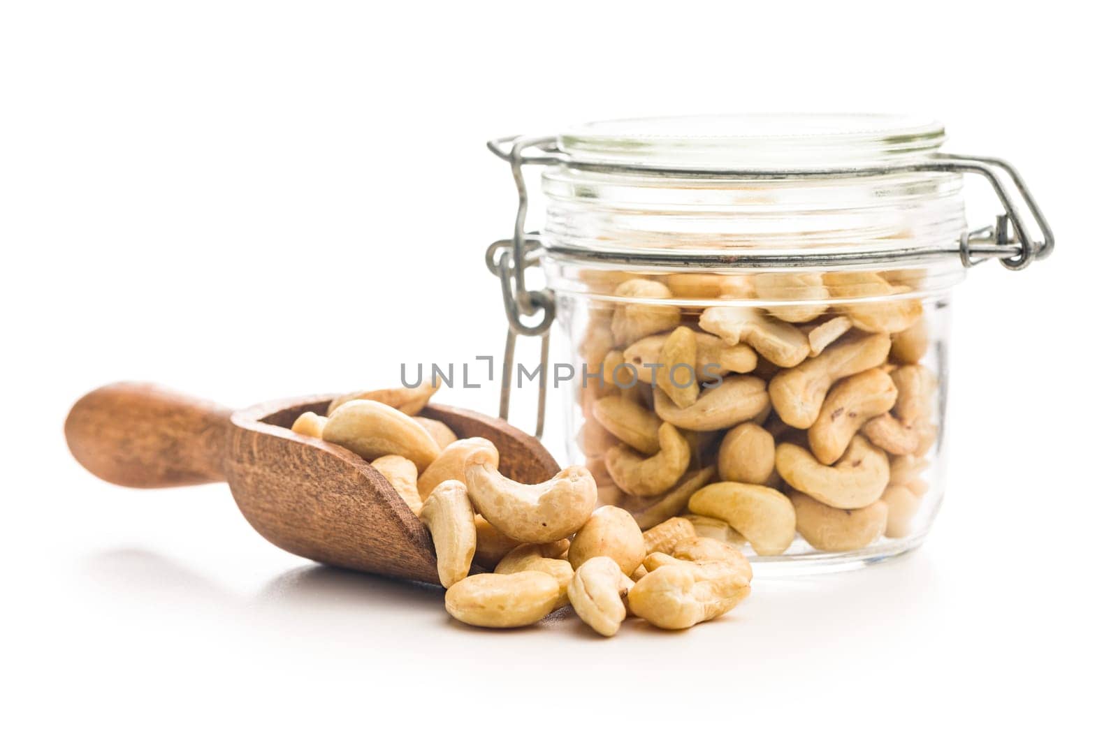 Roasted cashew nuts in scoop  isolated on a white background.