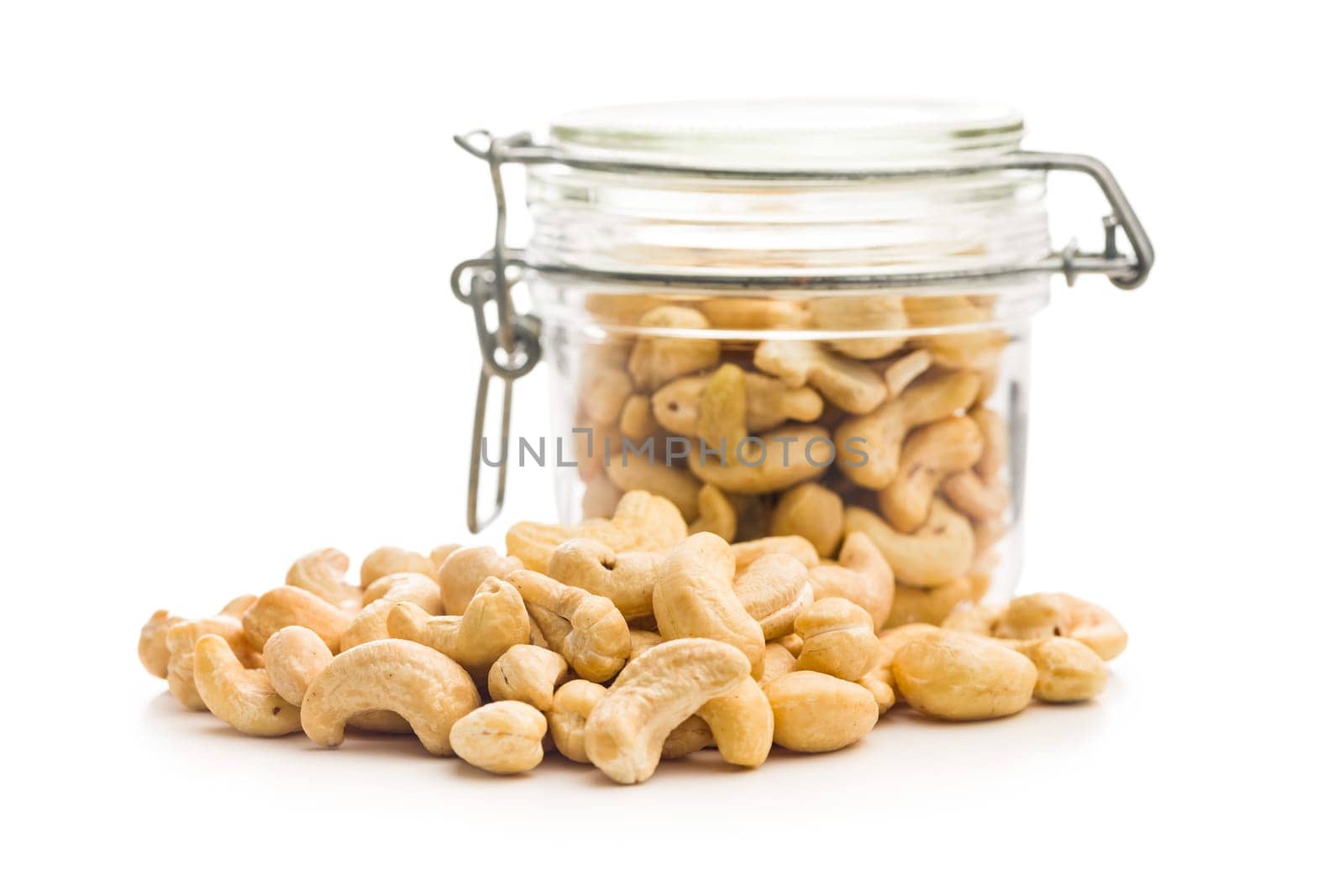 Roasted cashew nuts isolated on a white background.
