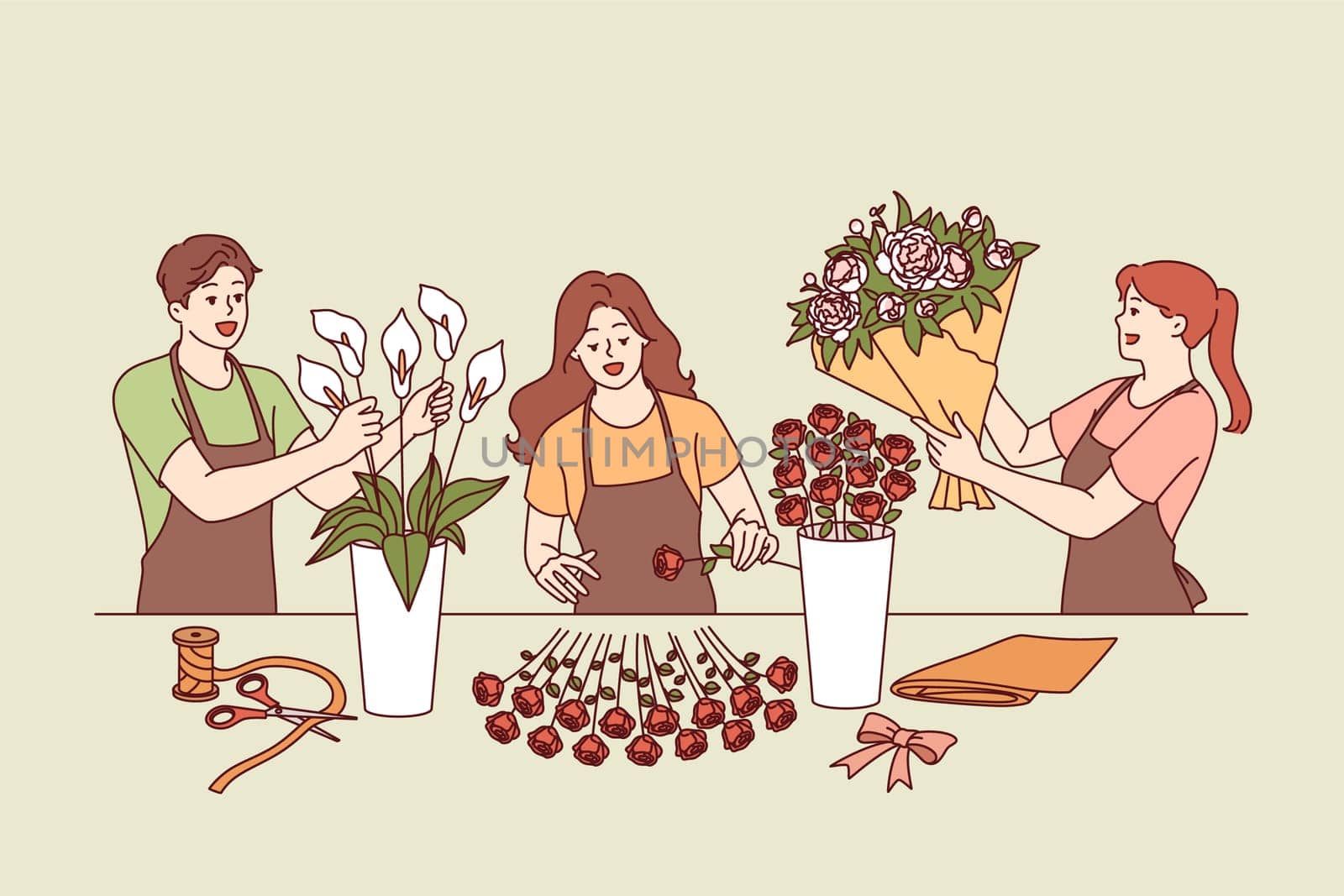 Flower shop employees collect festive bouquets for wedding or holiday party decoration. Man and two women working in flower shop create decorations from roses and lilies for event arrangements.