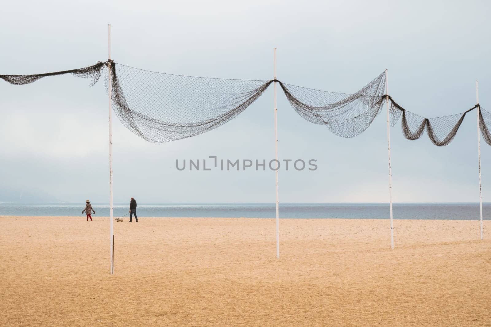 Peaceful walk on the beach in Nazaré, Portugal