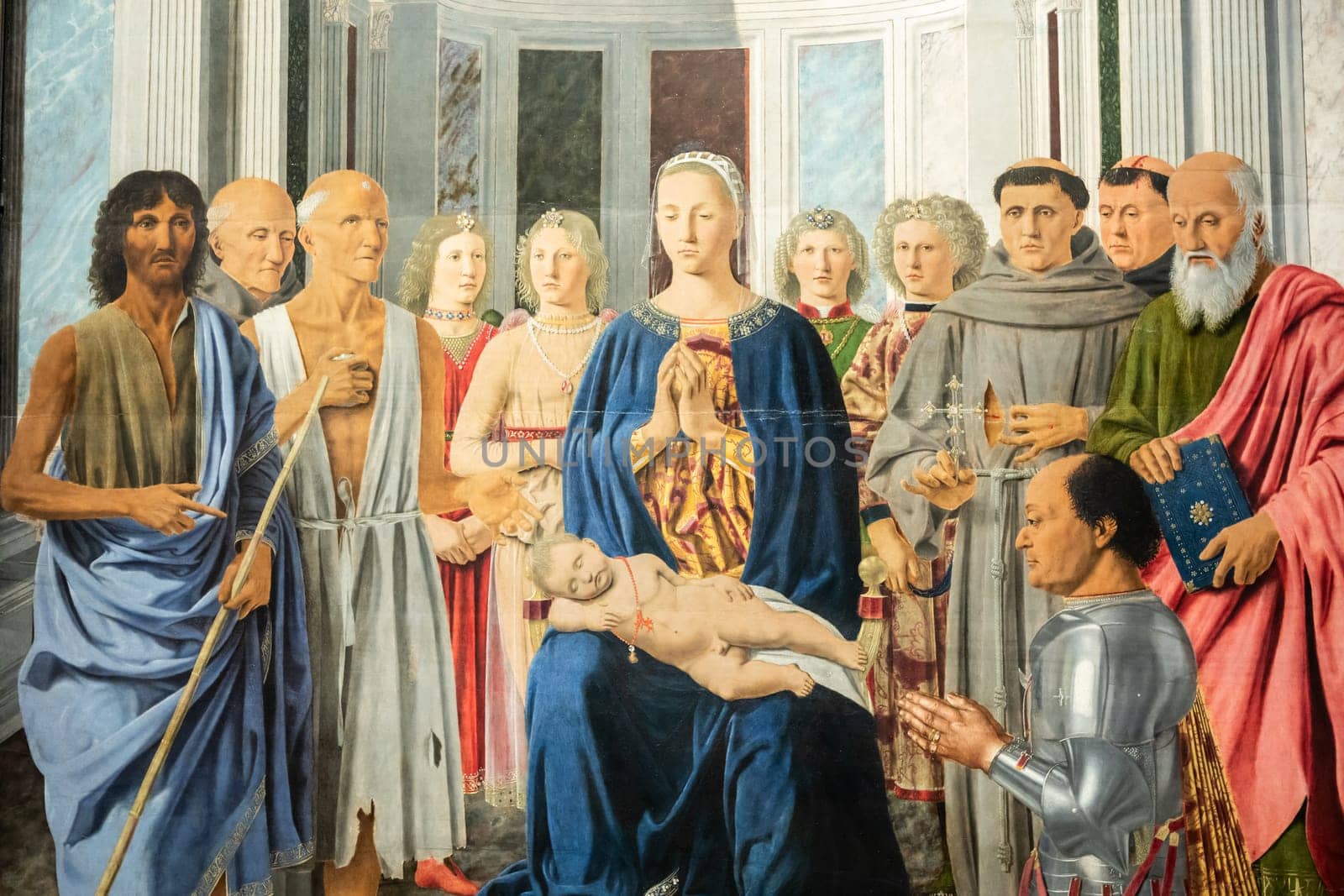 Milan, Italy - 23 September 2023: Brera antique painting museum. Madonna and child with saints, angels and Federico da Montefeltro, by painter Piero della Francesca, 1470