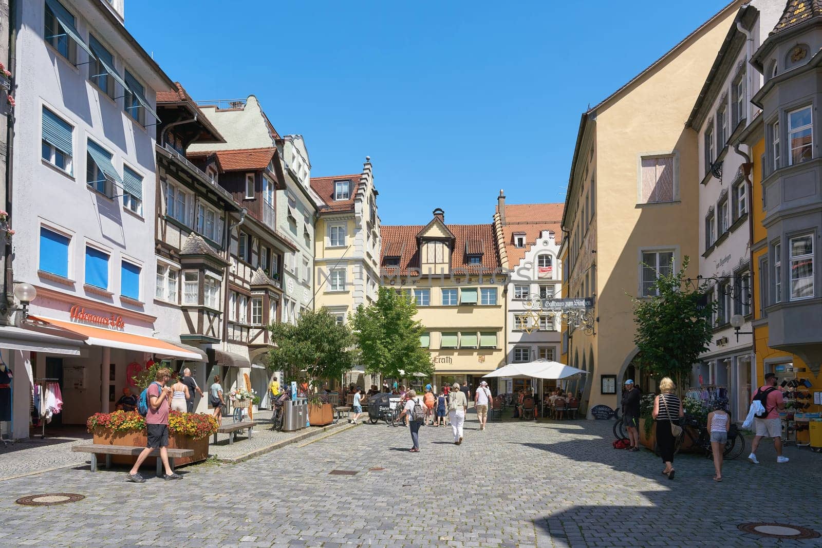 Tourists in a pedestrian zone in the old town in the Insel district of Lindau on Lake Constance, Bodensee