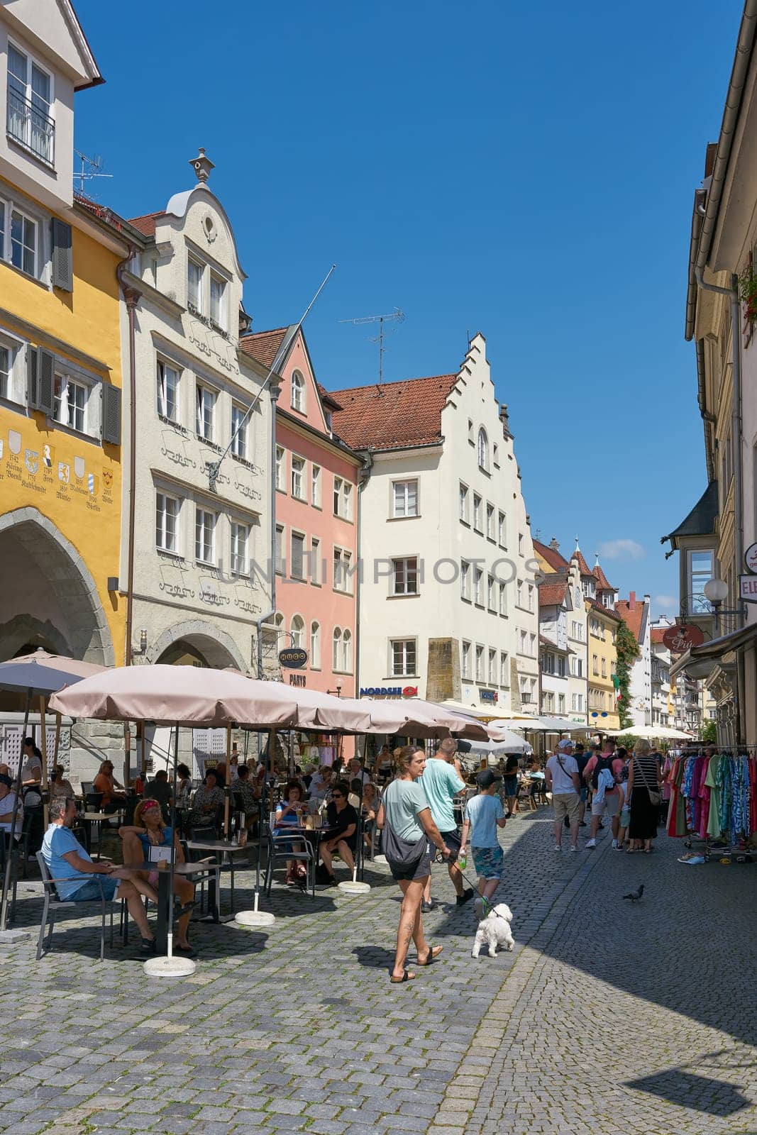Tourists in a pedestrian zone in the old town in the Insel district of Lindau on Lake Constance, Bodensee