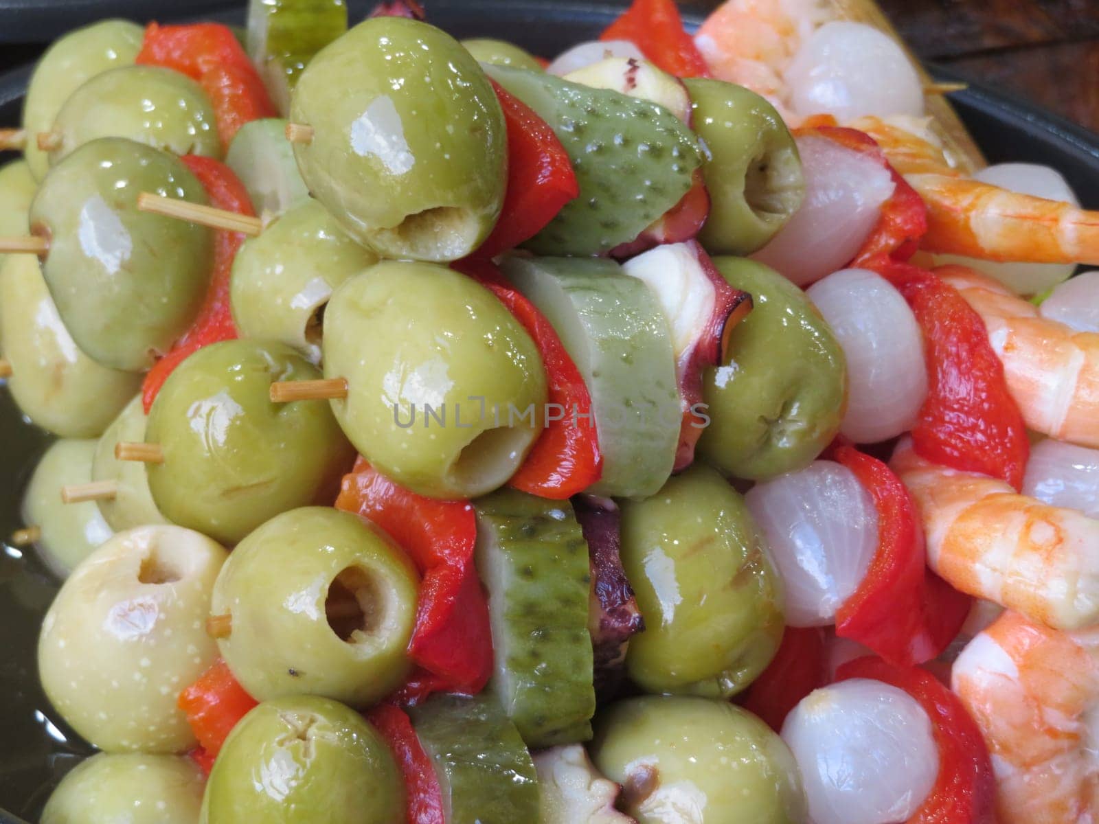 delicious pickles gherkins spring onions pepper shrimp skewer