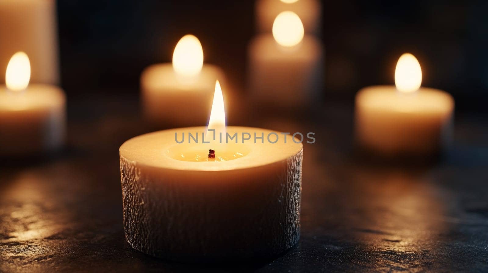 burning candles on the table.The flame of the candles flickers.on a dark background