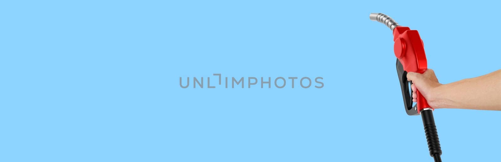 Hands holding Fuel nozzle on light blue  background