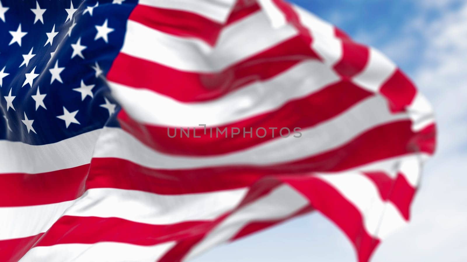 Close-up of the american national flag waving in the wind on a clear day. 3d illustration render. Selective focus.