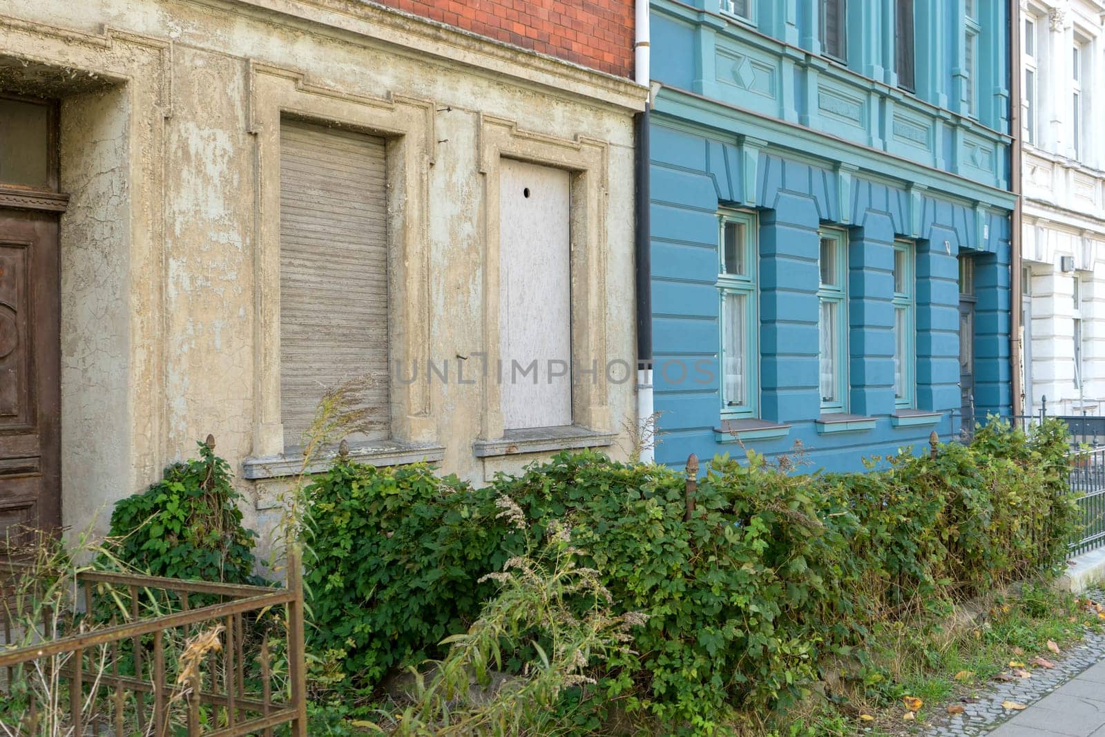 Detailed view of an old and a renovated house facade
