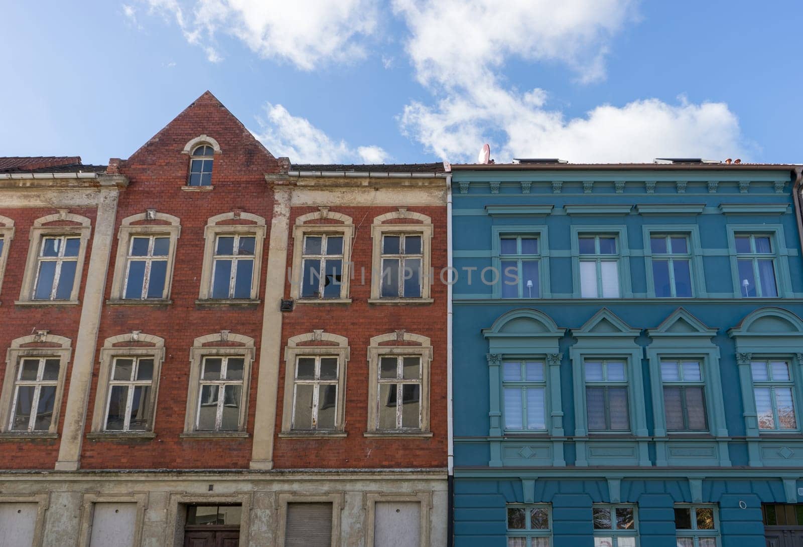 Detailed view of an old and a renovated house facade