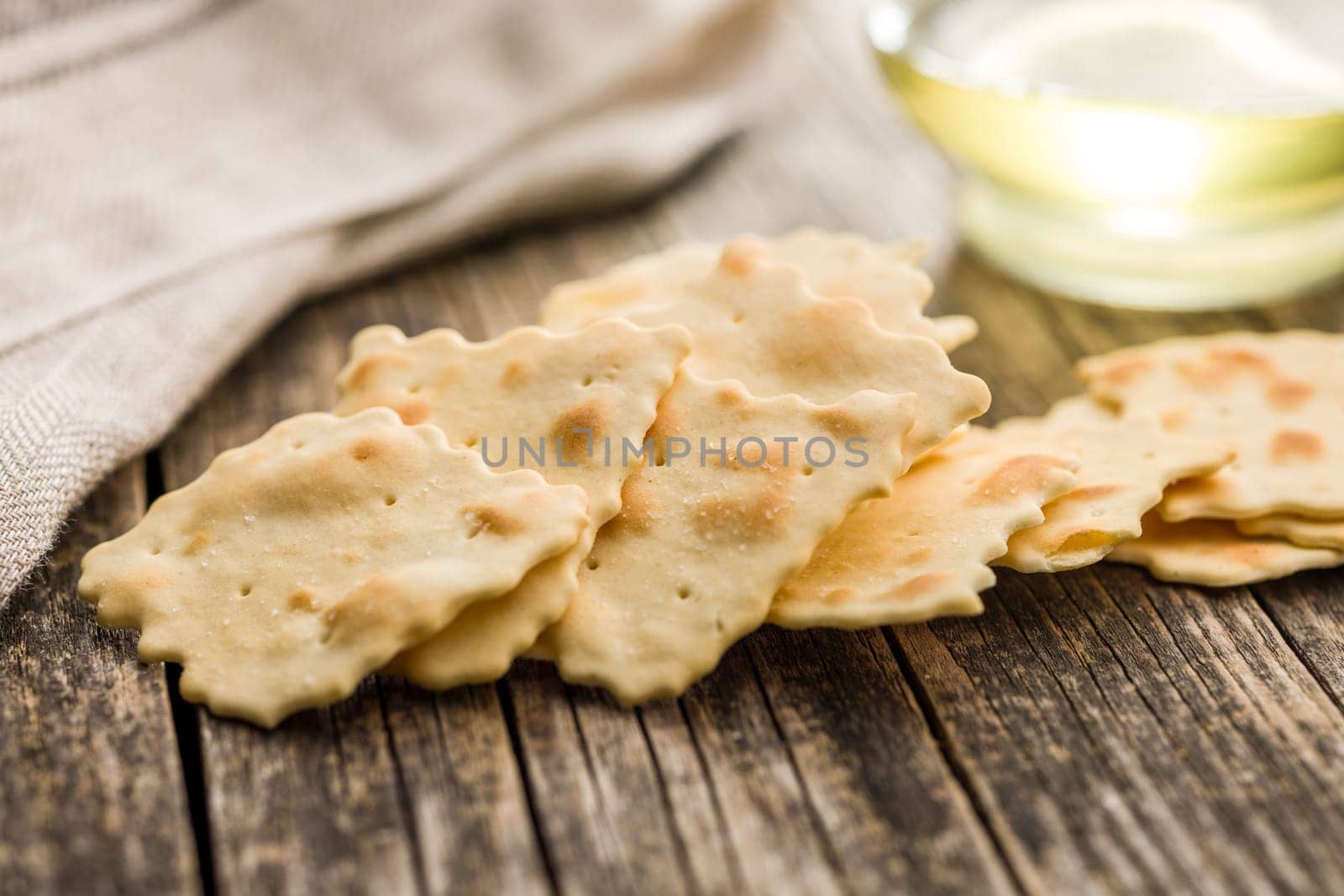 A crispy salted crackers  on a wooden table.