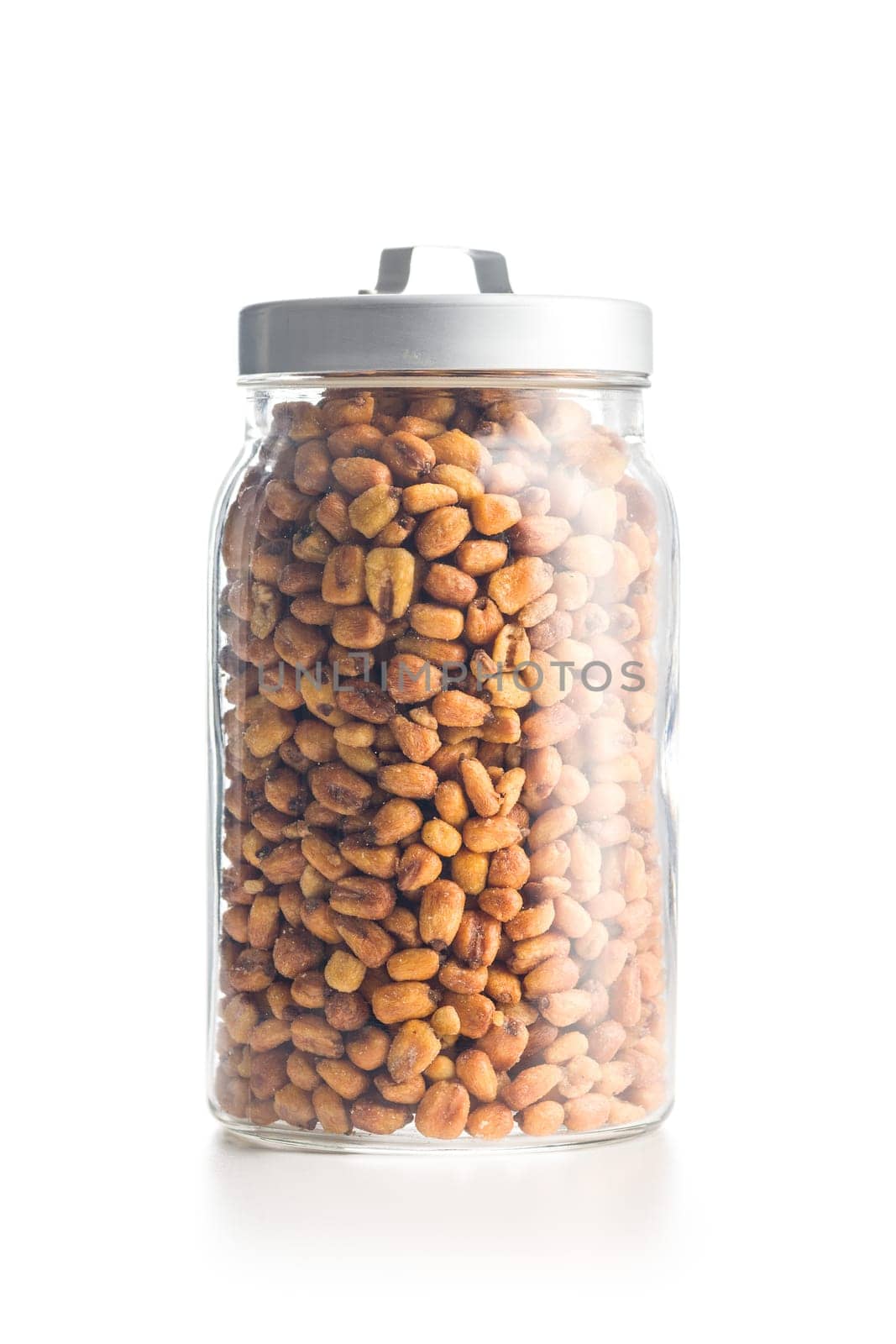 Roasted salted corn snack in jar isolated on a white background.