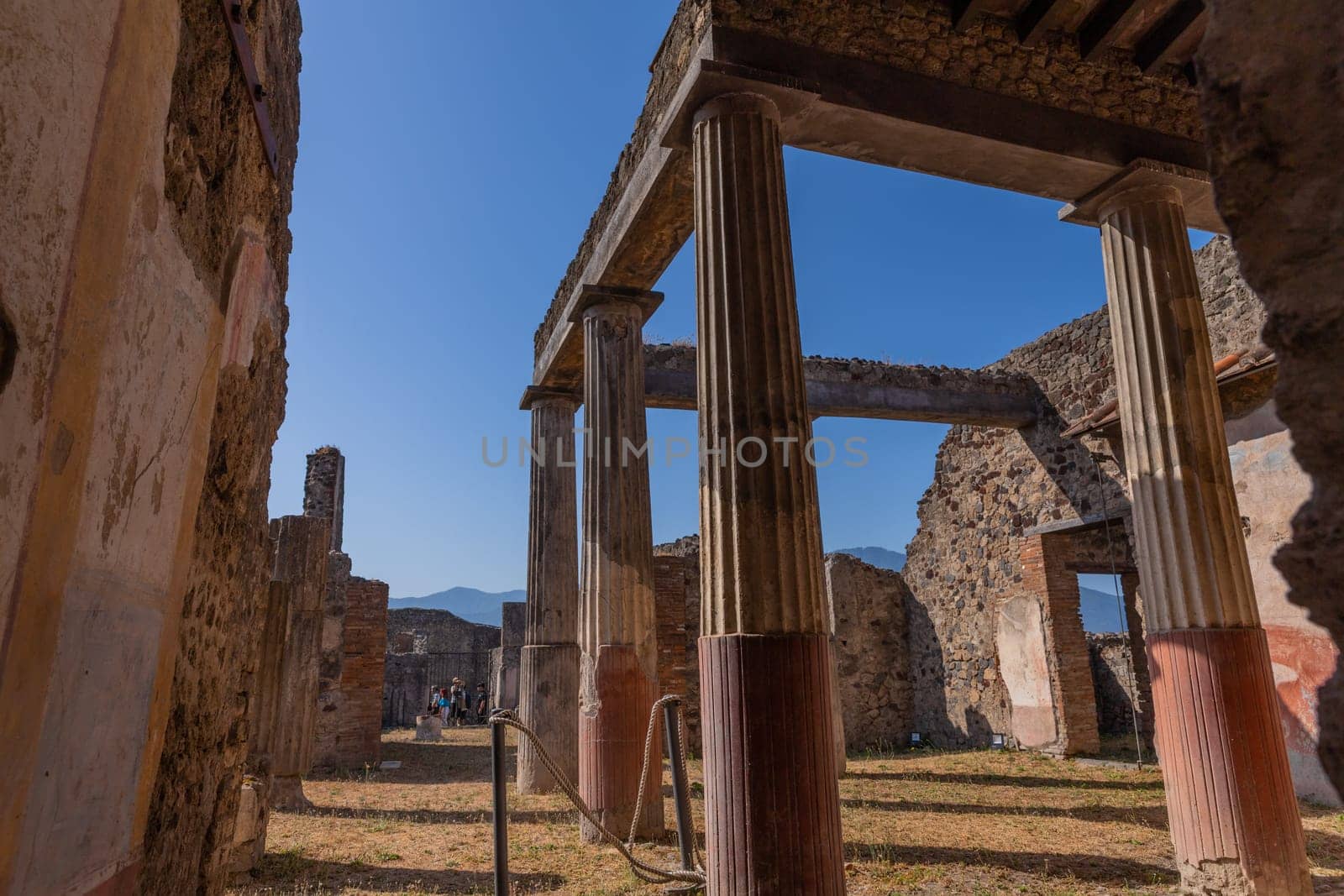 Pompeii, Italy - August 8, 2024: Ruins of a city. Pompeii is an ancient Roman city died from the eruption of Mount Vesuvius in 79 AD.